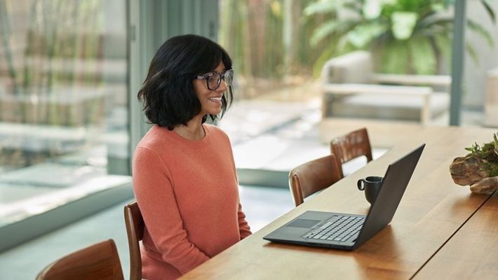 A woman works on her computer.jpg